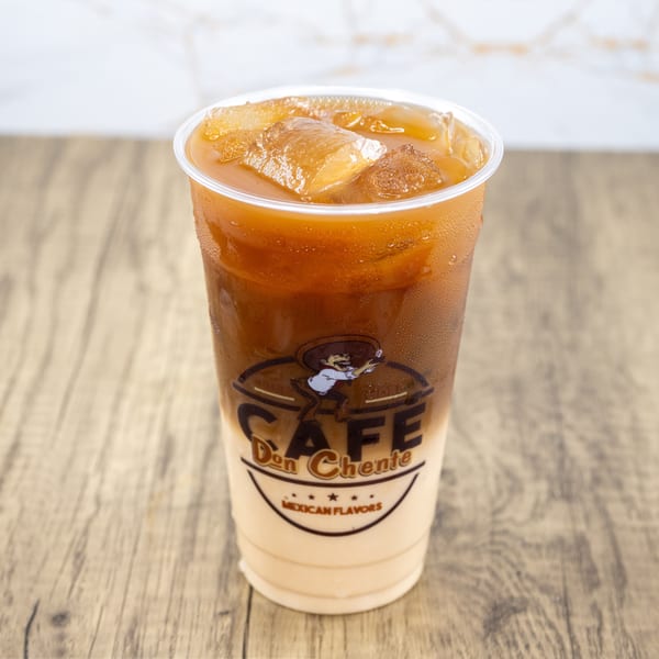 Iced coffee with milk in a clear plastic cup with the "Cafe Don Chente Mexican Flavors" logo.