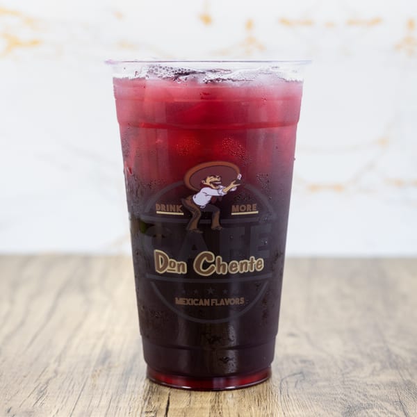 A clear plastic cup of iced red drink with the Don Chente Mexican Flavors logo.